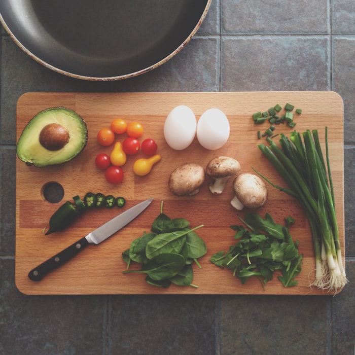 Fresh produce and ingredients on a kitchen prep station